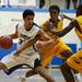 Pioneer senior Jibreel Hussein drives against Ypsilanti defenders on Monday, March 4. Daniel Brenner I AnnArbor.com